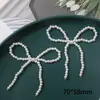 Ins Corea del Sur perla de imitación lazo corazón de melocotón diy tejido a mano clip para el pelo de cuentas accesorios para el cabello material para pendientes venta al por mayor