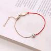 Versión coreana de este año de vida pulsera de cuerda roja de acero de titanio tejido con un solo diamante moda pulsera creativa pequeña joyería al por mayor