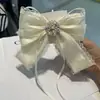 2025 Broche de Primavera de Perlas Estilo Coreano con Lentejuelas y Moño de Encaje Accesorios para el Cabello de Princesa para Mujer Venta al por Mayor