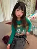 Hua Yu Xun Niñas Estilo Otoño 2026 Versión Coreana Dibujos Animados Conjunto de Dos Piezas Camiseta Infantil Estampada Ajustada Versátil Manga Larga Capa Base