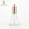 Botella gotero de antena en stock 50ml Botella de esencia Botella cónica transparente para aceite esencial con bomba de presión Botella dispensadora de loción Material de embalaje