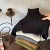 Suéter de cuello alto color crema 2025 Ropa nueva de otoño e invierno para niños y niñas Espesado Cálido Grueso Tejido Camiseta base para bebé Versátil
