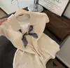 Suéter de punto para mujer con cuello polo de color avena, manga corta, holgado para verano, moderno, de alta gama, camiseta top