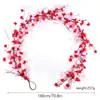 Flores de primavera rojas y rosas enredaderas en forma de corazón fábrica de origen colgante de puerta de casa decoración de chimenea San Valentín enredaderas de flores artificiales