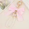 Chaveiro de Laço com Pérolas Estilo Japonês Doce Feminino Coração Fita Chaveiro Artesanal DIY Criativo Pingente de Bolsa