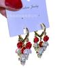 Pendientes de lujo ligeros de alta gama con diseño retro elegante de circonita con forma de hoja de arce, con hebilla para otoño e invierno, de moda y exquisitos.