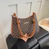 Bolso de hombro de moda retro minimalista, diseño de nicho, bolso casual nuevo, bolso de axila para mujer tendencia verano 2026