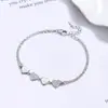 Pulseira de coração de camada dupla best-seller transfronteiriça para mulheres, joia de prata 925, design de nicho, moderna e elegante, sensação de alta qualidade