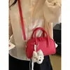 Bolsa de boliche rosa claro estilo doce para mulheres, nova bolsa de mão texturizada de nicho para o verão de 2026, bolsa de corrente para o trabalho