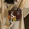 Otoño/Invierno 2026 Cuadros Versátil Nuevo Estilo Viaje al Trabajo Bolsos Cruzados de Nicho para Mujer Bolso de Hombro Simple Coreano de Mano