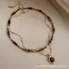 Directo del FabricanteCollar con Colgante de Ojo de Tigre con Perlas Maillard de Doble Capa con Encanto Vintage
