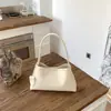 Bolso de mano nicho estilo minimalista coreano para mujer, nuevo de verano 2026, versátil retro para uso diario, bolso casual de hombro y axila