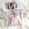 Bolsas de almacenamiento de terciopelo de alta gama al por mayor personalizadas, bolsas de terciopelo de seda con cordón para llevar en la mano, bolsas de tela para empaquetado de regalos, se pueden bordar con LOGOTIPO