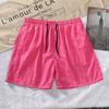 Venta al por mayor de fábrica 22 verano pantalones cortos casuales para hombre color caramelo pantalones para hombre 14 colores Comercio exterior pantalones de playa en nombre del envío
