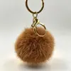 Lindo Nutria Conejo Piel Pompón Pequeño Llavero Colgante Ins Celebridad de Internet Peluche Bola Pequeña de Carbón Colgante para Mochila Bolso Adorno Regalo