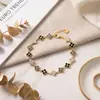 Pulsera de Trébol de Cuatro Hojas Estilo Francés Europeo y Americano, Sensación de Lujo Ligero y Gama Alta, Pulsera Completa de Circonita Diamantada, Joyería de Acero de Titanio, Exclusiva de Fábrica para Suministro Transfronterizo