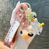 Chaveiro de Urso Cartoon Bebendo Óleo com Coração de Areia Movediça, Chaveiro Criativo para Casal, Pingente de Bolsa para Carro Tendência