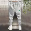 Pantalones deportivos populares de marca de celebridad de Internet para hombre, corte ajustado, hasta el tobillo, para hombre, otoño e invierno 2022