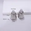 Venta al por mayor de fábrica Colgante de campana metálica Colgante de alas de plumas Estilo Punk Accesorios para joyería DIY