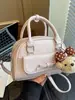 Bolsa de mano de nuevo estilo Primavera 2026 Transfronteriza para Mujer, Bolso tipo concha, Informal, Simple, Nicho, Moda, Bolso de hombro cruzado