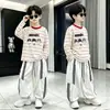 Nueva camiseta de manga larga a rayas para niños, elegante y casual, capa base versátil para niños mayores, top de cuello redondo estilo coreano