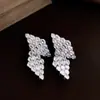 Pendientes de aro con colgante redondo de ojo de tigre Maillard para otoño e invierno, sensación de lujo ligero y alta gama, pendientes versátiles de estilo vintage para mujer