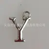 Plata retro 26 letras inglesas aleación mixta accesorios de joyería letras colgante pequeño material para teléfono móvil venta al por mayor