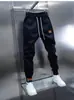 Calça Jogger Masculina Nova e Moderna com Cordão na Cintura Elástica, Calça Esportiva Casual, Calça Versátil de Corte Slim