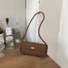 Bolsa de axila feminina de nicho, nova bolsa de ombro casual da moda outono 2026, requintada para o trabalho e o trajeto, bolsa transversal