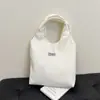 Bolso de Ocio de Nicho para Mujer 2025 Nuevo Bolso de Hombro Rayado de Pana Estudiante Viajero Plegado Bolso Temprano de Ocho Bajo el Brazo