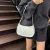 La popular bolsa de axila de este año es el nuevo bolso de hombro de moda versión coreana nicho 2026, un bolso cuadrado pequeño versátil de color sólido