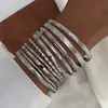 Moda Europea y Americana Nuevo Estilo Moda Personalizada Grabado Trenzado Geométrico Multicapa Apilados Pulseras Set de 10 Piezas Accesorios Al por Mayor
