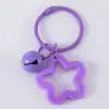 Llavero con Colgante de Campana de Estrella de Cinco Puntas de Colores Caramelo de Aleación Cubierta para Auriculares Decoración de Pareja