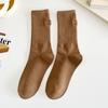Medias color té con leche suaves tacón elegante bordado pequeño corazón niña calcetines hasta la pantorrilla ins calcetines apilables de celebridad de Internet al por mayor