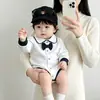 Mono de algodón puro para bebé 2026 nuevo modelo ropa para recién nacido mameluco triangular para bebé versión coreana mameluco de manga larga con pajarita