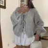 Cárdigan de punto con cuello redondo y lazada, estilo europeo y americano, nuevo suéter casual simple de punto grueso para otoño e invierno para mujer