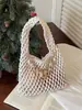 Bolso de Punto Calado de Diseño de Nicho para Mujer 2026 Nuevo Verano Estilo Coreano Versátil Bolso Tejido Hecho a Mano Bolso de Cubo de Mano