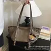 Colgante lindo de dibujos animados de moda japonesa y coreana 2026 nuevo para mujer de otoño bolso de hombro de alta gama brillante bolso de axila