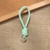 Bolsa de Corda de Couro PU Colorida Pingente Estilo Miu Simples Versátil Charme de Bolsa Chaveiro Acessório Lanyard de Celular Estilo Curto Novo
