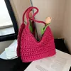 Versión coreana 2026 nueva bolsa tejida simple versátil hecha a mano, bolsa de dumplings para vacaciones, bolso de hombro de nicho, bolso de mujer de moda