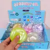 Juguete de apretar de aceite de coco colorido, iridiscente, superventas transfronterizo, empaquetado en una caja colorida, diseñado para aliviar el estrés