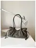 Bolso de axila retro casual de alta gama para mujer, nuevo bolso tote de diseño de nicho elegante, bolso de hombro y de mano
