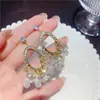 Brincos de Franja de Cristal Oval com Cravação de Diamantes e Pérolas Estilo Palaciano Retrô Europeu e Americano Brincos Modernos e Elegantes para Mulheres