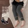 Etiqueta de tela con volantes empalmada Leggings para niños Otoño e Invierno Nuevo Forro polar Engrosado Pantalones para niñas Mallas para bebés