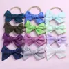 Venta al por mayor de fábrica hecho a mano color sólido lazo de algodón diadema de nailon para niños niña diadema suave