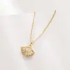 2025 Nuevo Collar de Falda Pequeña de Ginkgo Lleno de Diamantes Circonita Micro-Pavimentada Oro Auténtico de 14K Chapado en Oro Colgante de Moda