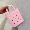 Bolsa de Gelatina 2026 Novo Modelo Transfronteiriça DIY Bolsa Perfurada Bolsa Feminina Cor Macaron Cesta de Higiene Pessoal de Praia Bolsa de PVC