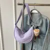 Bolsa Transversal Explosiva Feminina Transfronteiriça 2024 Nova Bolsa de Lona de Nylon Formato Bolinho Versátil de Ombro de Alta Qualidade Pequena Bolsa de Pano