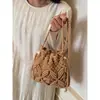 Bolso de paja tejida para mujer, nueva tendencia de moda 2025, diseño de nicho, bandolera tipo cubo, bolso de playa para todo tipo de combinaciones.