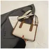 Bolso de lona de gran capacidad para mujer, nuevo bolso bandolera de un solo hombro de alta gama, versátil, para uso laboral, 2025